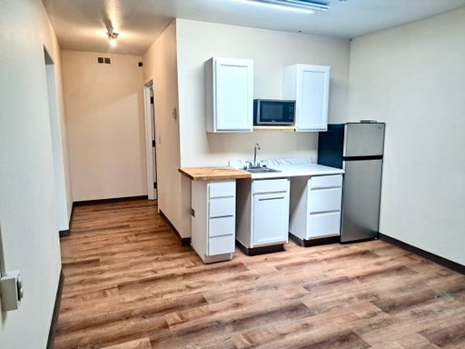 UNDER NEW MANAGEMENT: Accessible Studio w/ Laminate Floors! All-Inclusive "One Bill" Living, Free Wi-Fi & Laundry!