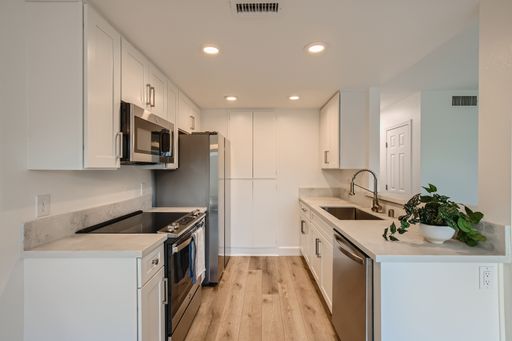 Recently Renovated!! - 3 Bedroom/2 Bath First floor corner unit with 2 car garage and A/C!!! – photo 1