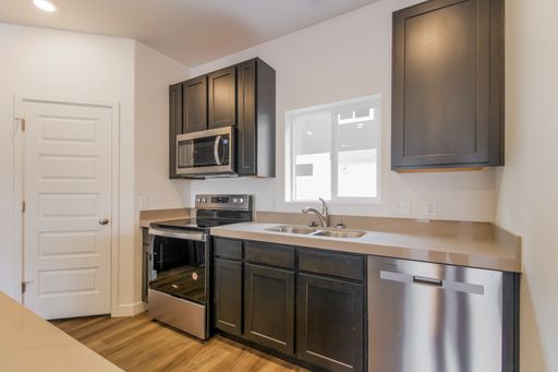 Modern three-story new build townhome with a rooftop deck! – photo 1