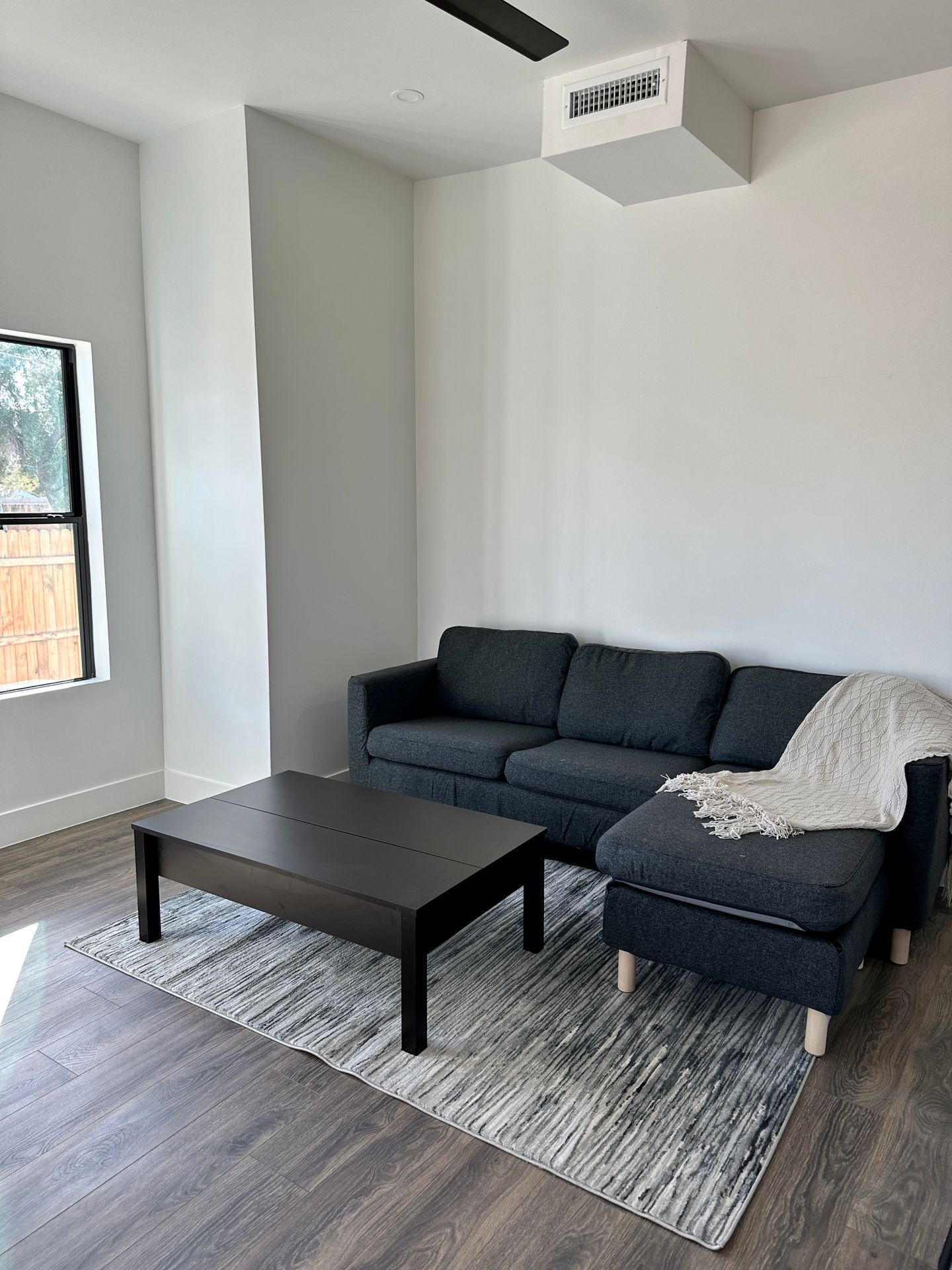 Furnished apartment living area shown at 326 North 17th Drive.