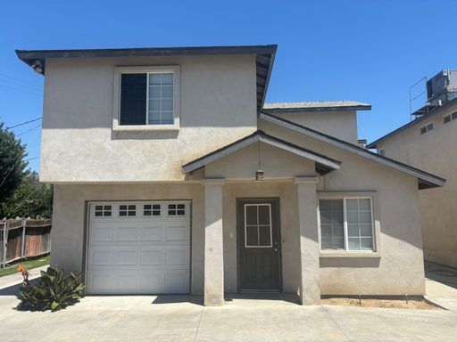 2 Bedroom Townhouse with Attached Garage, Water Paid & Off-Street Parking
