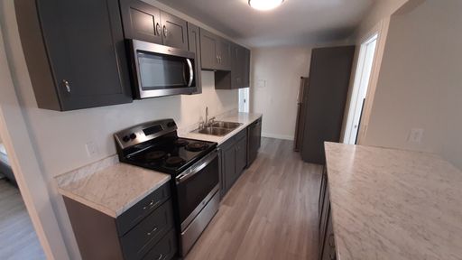 Renovated 2 bedroom apartment with off street parking! – photo 1