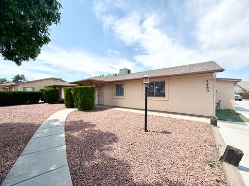 Spacious 3-Bedroom, 2-Bath Triplex Unit with Covered Carport – photo 1