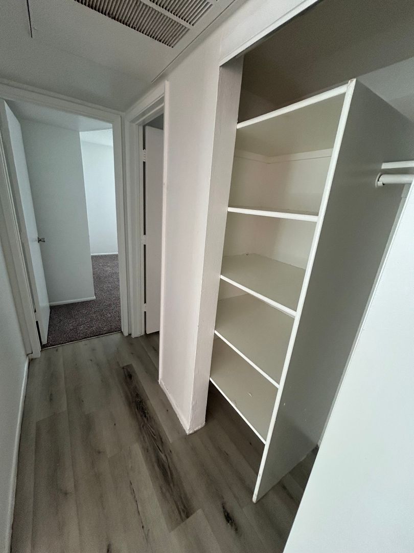 Closet storage — representative home at San Marina Apartments.