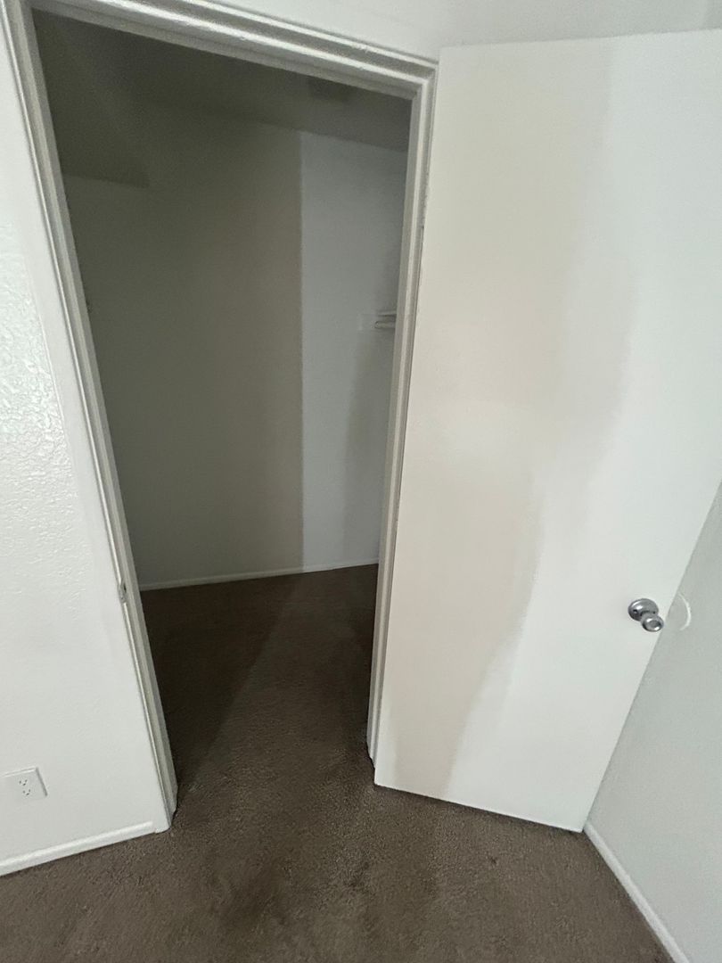 Closet storage — representative home at San Marina Apartments.