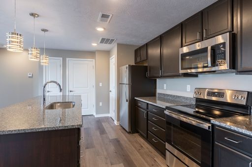 Retire at the end of the day to your cozy master bedroom, while a guest or family member enjoys a spare bedroom, both with ample closet space. – photo 1