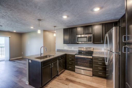 Retire at the end of the day to your cozy master bedroom, while a guest or family member enjoys a spare bedroom, both with ample closet space. – photo 1