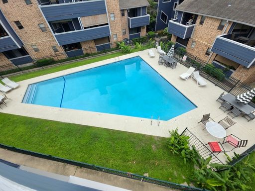 Stylish Two-Story Condo with Spiral Staircase & Pool Views | 2 Bedrooms | Private Balcony – photo 1