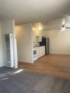 DOWNSTAIRS END UNIT 2 BED 1 BATH WITH ALL NEW FLOORING AND BACKYARD