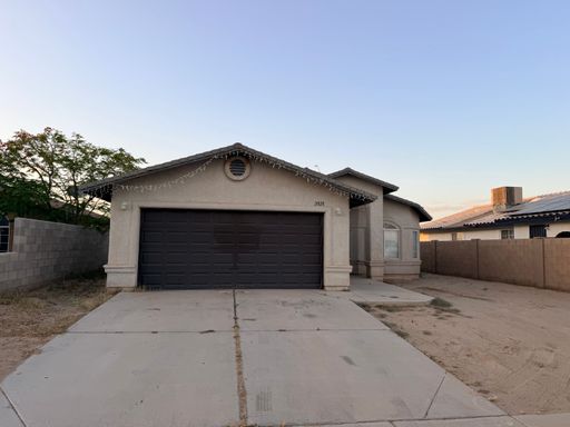 Three Bedroom Home with Two Car Garage and Fenced Lot in San Luis AZ.