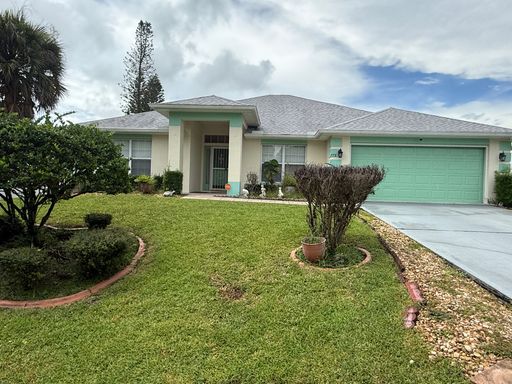 $2300 | Welcome Home to this Upgraded 3/2 Oasis in Palm Bay – photo 1