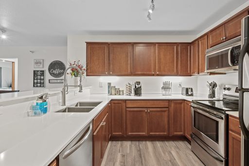 1,135 Sq Ft 2nd level corner unit 2 bed 2 bath balcony in-unit laundry – photo 1