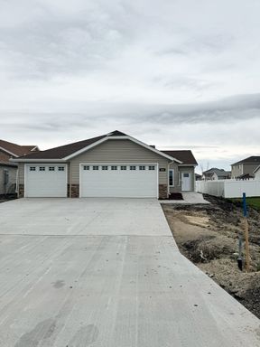 3 Bed with Den 2 Bath Single Level Townhome with 3 Stall Garage – photo 1