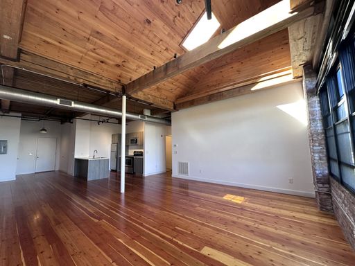 Stunning Top Floor Corner Unit w/ City Views, Garage Parking + In-Unit Laundry – photo 1