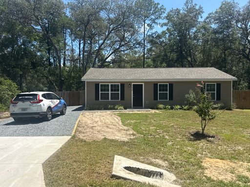 Newer 3/2 in the country with fenced yard and shed