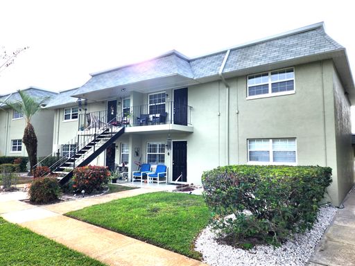 Second Floor Condo Unit with Balcony and Pool View – photo 1