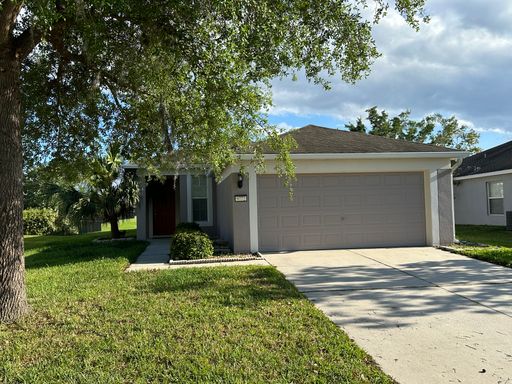 Spacious 3 bedroom home with view of pond in backyard