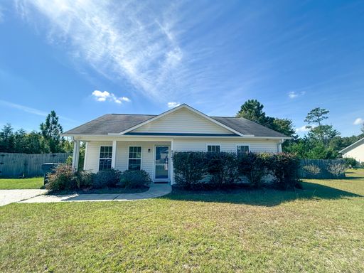 Welcome to this charming 3 bedroom 2 bathroom home in Leland – photo 1