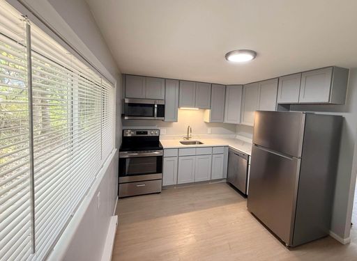 Prime 2BR haven at The Fitch: Poolside bliss, pet-friendly, steps from Boston rail! – photo 1
