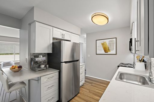 2 Bed for the price of a 1 bed! Renovated with stainless steel appliances, plank floors, quartz countertops