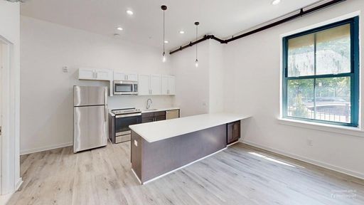 No traditional security deposit required! Brand-New Renovated 2BR/1BA in Newark | High Ceilings + Modern Finishes – photo 1
