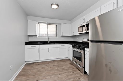 Large condo quality 1-bedroom, 1-bathroom unit with new rehab! No security deposit! Heat included! – photo 1