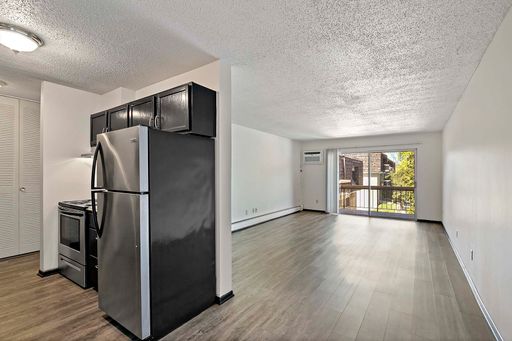 SMOKE FREE Two Bedroom Two Bath on First Floor with vinyl flooring, balcony and wooded views