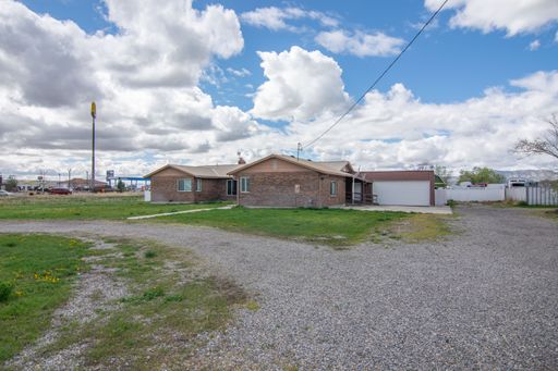 Spacious 3 Bed 2 Bath Brick Home with RV Parking, Shop Space & Large Yard in Tremonton!