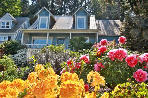Stunning View With This Cape Cod Cottage In Langley!