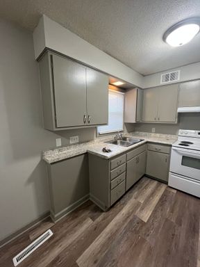 Your next 2 BR apartment is tucked in a quiet little neighborhood, completely remodeled!