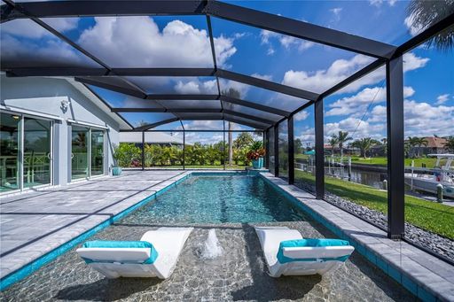 FURNISHED SHORT TERM RENTAL - 3 Bed / 2 Bath - Single Family Pool Home - $5,000/month ** Heated Swimming Pool ** Canal View – photo 1