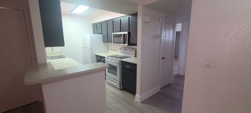 $0 FIRST MONTH! Spacious 2BR/2BA in Mesa | LVP Floors, Pool & Covered Parking – photo 1