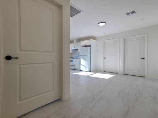 View through an interior doorway into Unit 1 living area.