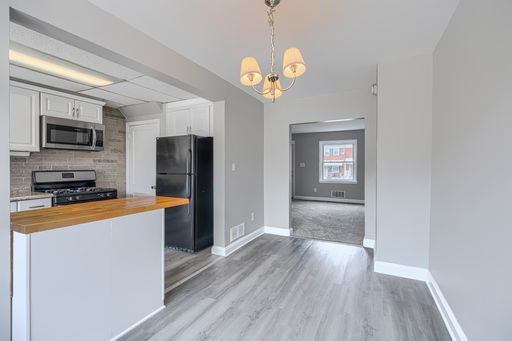3 Bed 1 Bath Rowhome with OFFSTREET PARKING AND OUTSIDE STORAGE – photo 1