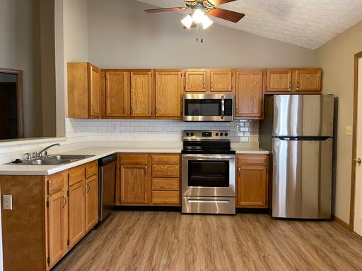 Wake up to a stunning pond view in this beautiful 2 BD 2BA duplex with a 2 car attached garage – photo 1