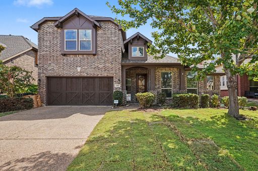 Welcome to 2412 Lynbridge Dr. This home offers original hardwood flooring, comes equipped with a Tesla Charging Station, a high-end water filtration system that filters the entire home, permanent holiday lights, Split floor plan with 4 bedrooms downstairs – photo 1