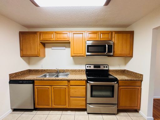 * RE-RENTAL AVAILABLE 8/14/26 * 4 Bedroom, 2 Bath Apartment – photo 1