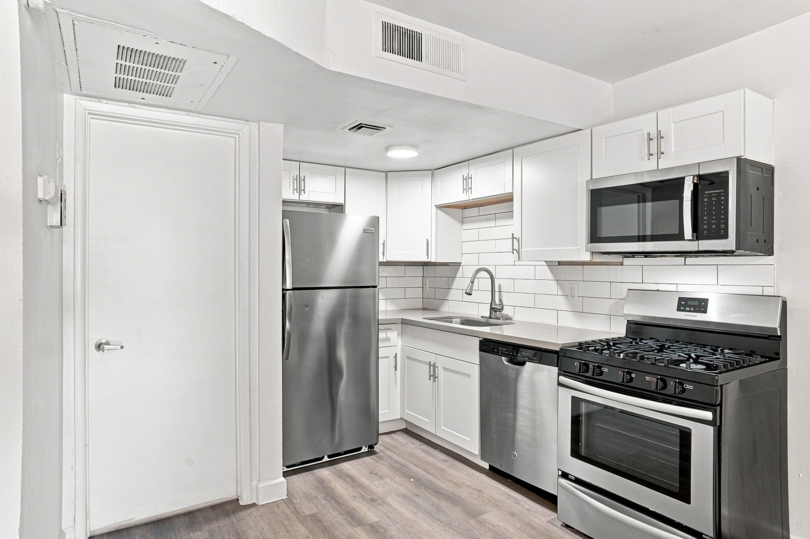 Apartment kitchen — representative home at The Element.