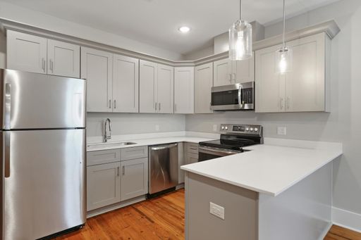 Stunning Historic Carriage House one block off of St. Charles! – photo 1