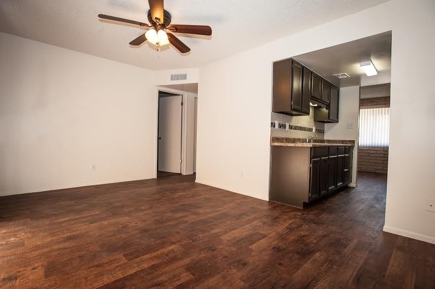 Unfurnished living room adjoining the kitchen — view 1 at Renovatio Apartments.