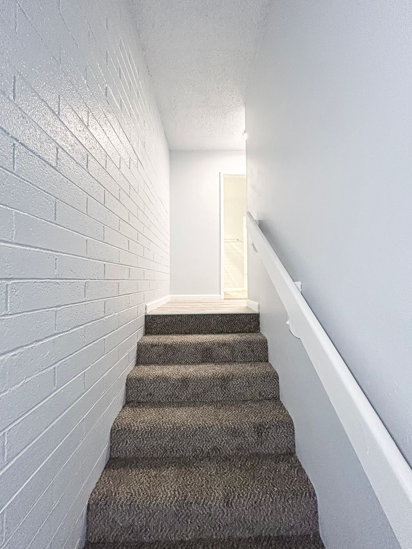 Representative interior staircase in the home shown at Villa Serena.