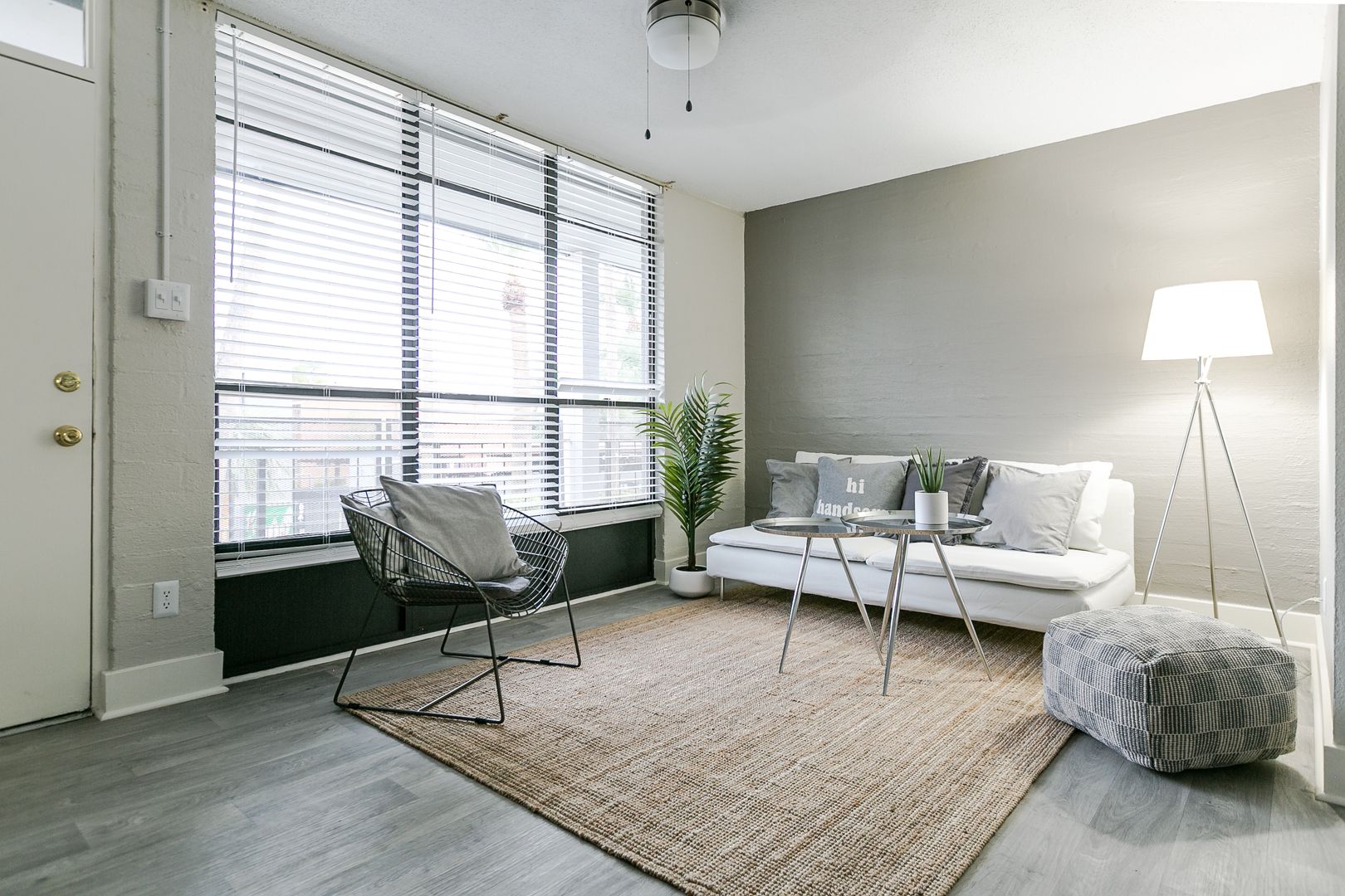 Furnished apartment living area shown — representative home at The Marlowe.