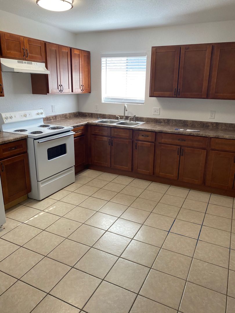 Apartment kitchen — representative home at 10015 North 9th Avenue.