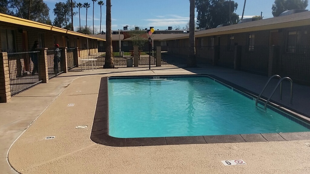 Swimming pool beside the single-level apartment buildings — view 1 at Renovatio Apartments.