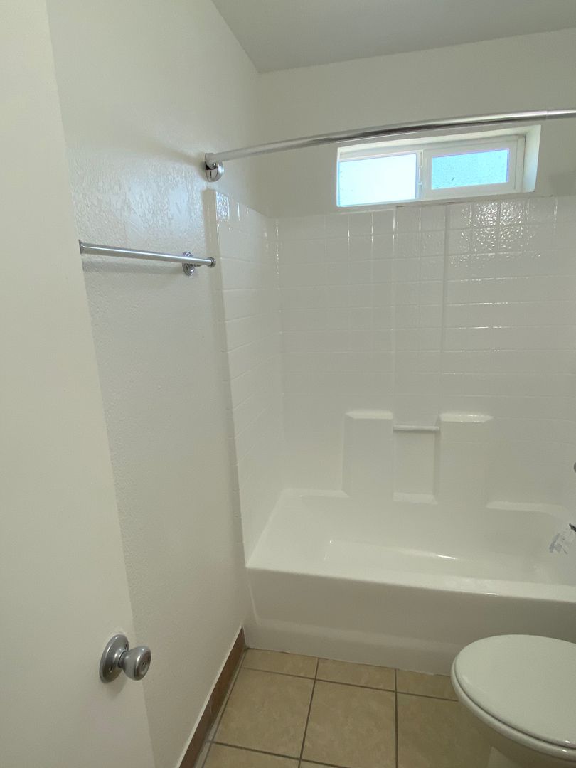 Apartment bathroom — representative home at 10015 North 9th Avenue.