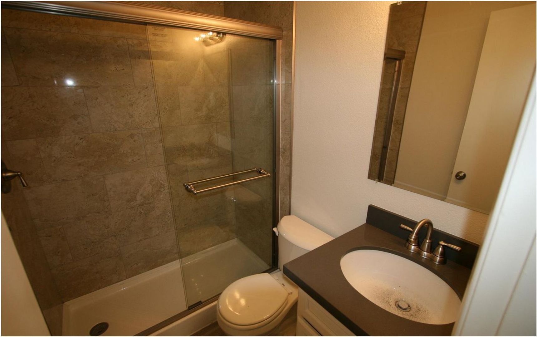 Apartment bathroom — representative home at 12 Palms Apartments.