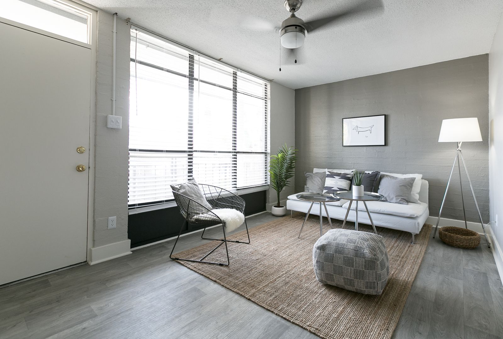 Furnished apartment living area shown — representative home at The Marlowe.