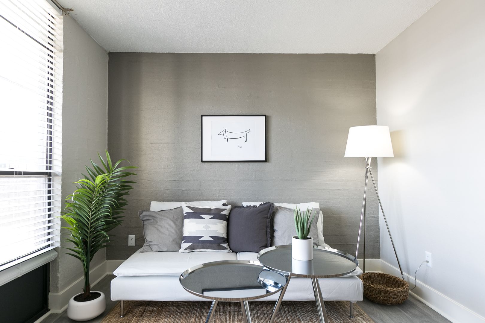 Furnished apartment living area shown — representative home at The Marlowe.