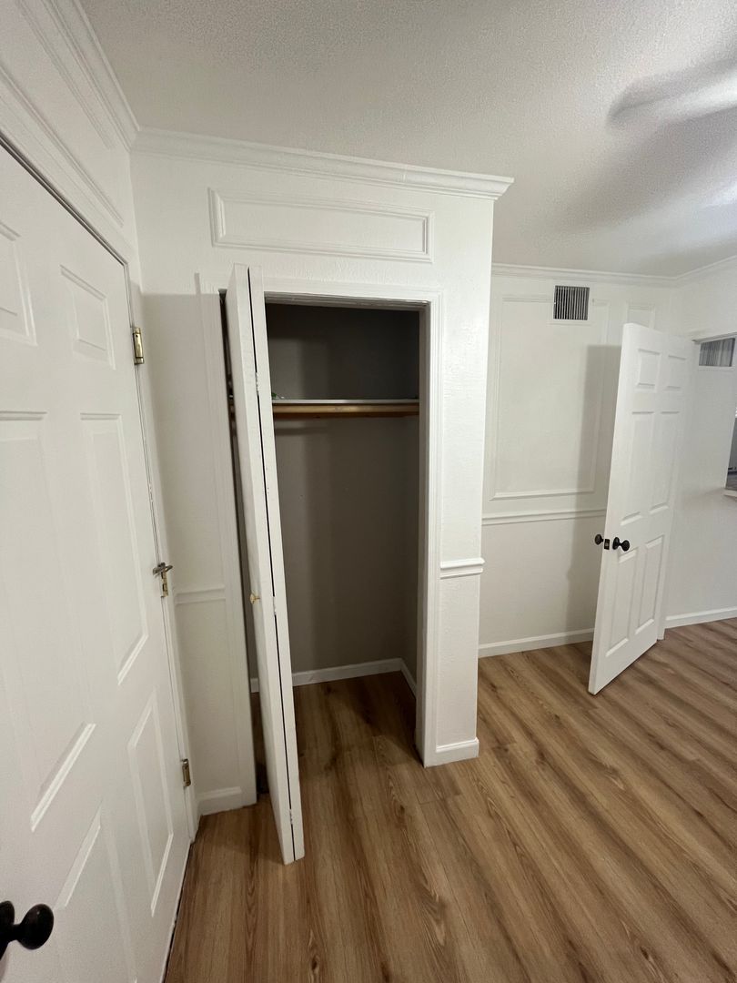 Unfurnished bedroom at San Juan Apartments.