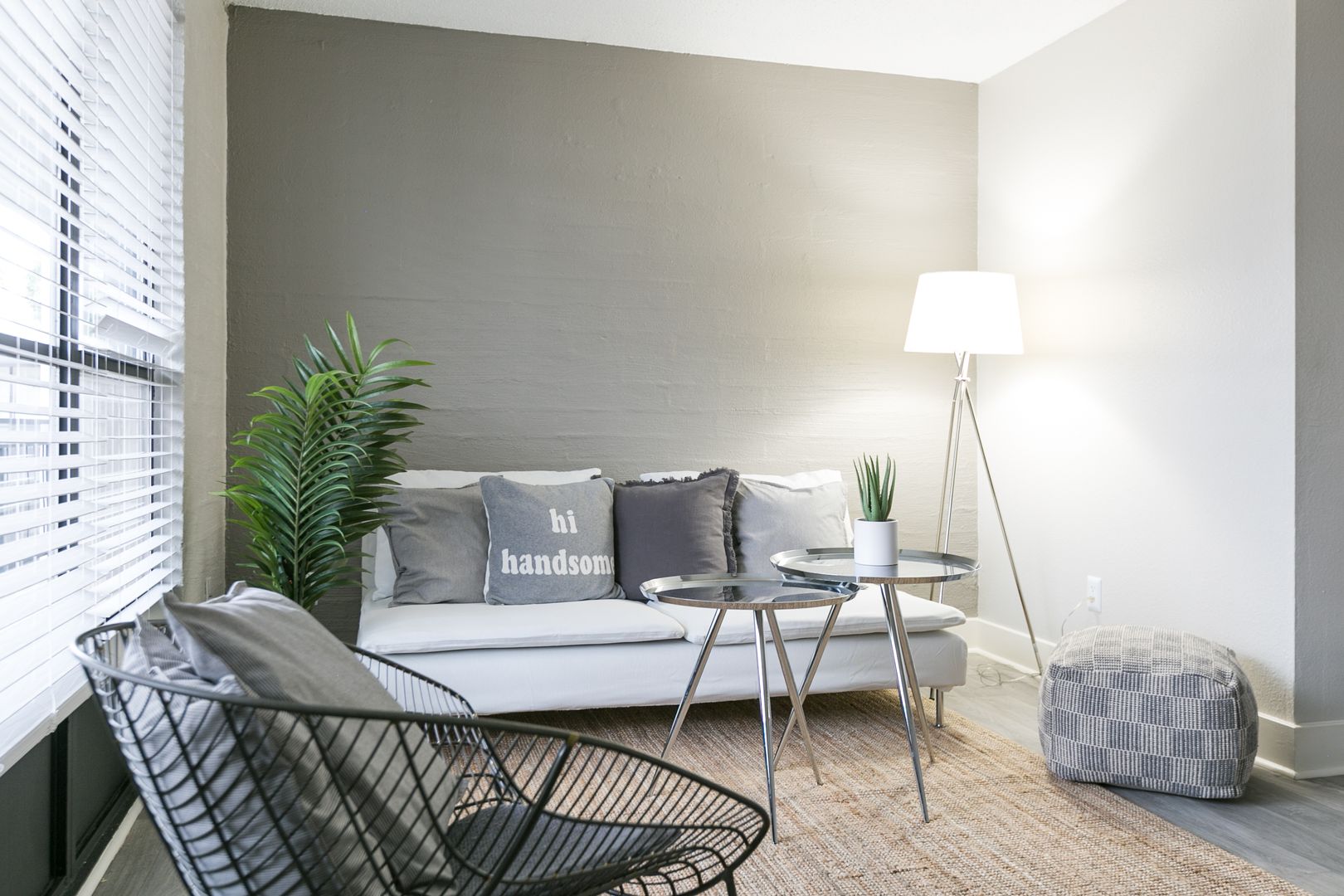 Furnished apartment living area shown — representative home at The Marlowe.